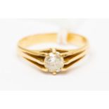 A diamond solitaire ring, approx 0.70 ct, assessed 18ct gold mount; a gents signet ring size V½.