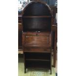 A mid 20th century bureau with plate racks and drawer.
