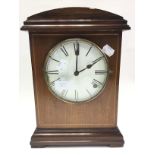 Mahogany mantle clock with Roman numeral dial