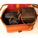 A Rolleiflex leather cased camera,