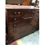 Large modified mahoganny chest of drawers with bun feet.