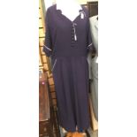 A 1940's blue crepe rayon dress with over stitched front bust area, darted (swing) skirt to back,