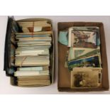 A box of assorted postcards, early 20th Century to modern,