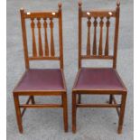 An Edwardian Art Nouveau set of eight oak side chairs, circa 1905,