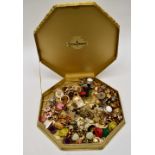 A large collection of paired clip earrings in decorative box