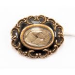 Late 19th Century gilt metal mourning brooch with lock of hair inside - 1881, scalloped surround,