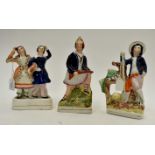 Three mid Victorian Staffordshire figures, dancers,
