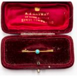 A turquoise composite and unmarked gold pin, length approx 30mm, total gross weight approx 1.