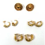 A collection of gold earrings to include a pair of sapphire and diamond channel set earrings,