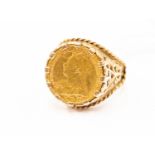 A 1/2 sovereign ring, Victoria 1900, set in unmarked yellow metal, size V,
