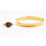 A gold bangle, diamond cut texture, Middle Eastern 24ct gold, internal diameter approx 65mm,