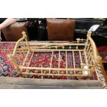 A 20th century doll's bed frame, as found.