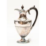 A silver hot water jug with ebonised wooden handle James Deakin & Sons,