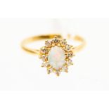 An opal and diamond cluster ring,