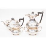 An Edwardian four piece sterling silver tea and coffee service, by Walker & Hall, comprising teapot,