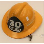 US Fire Department Yellow Plastic Helmet. "30 MFD" badge to front.