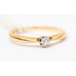 A diamond solitaire ring, 18ct gold knife edge shoulders, the old cut diamond claw set, weighing 0.