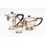 An Art Deco three piece teaset comprising teapot, hotwater jug and milk jug, Birmingham 1938,