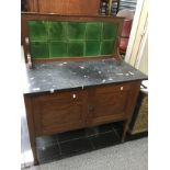 A Victorian marble topped and tile backed washstand.