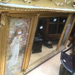 A giltwood mantle mirror with picture side panels.