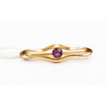 An amethyst coloured stone set in 9ct yellow gold,