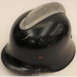 West German M34 Fire Helmet. Alloy comb to crown. Original black paint. Marked "DIN14940".