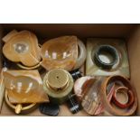 Two boxes containing a collection of assorted agate ashtrays, onyx, serpentine napkin ring,