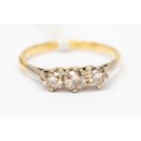An 18ct and platinum three stone diamond ring, total diamond weight approx approx 0.