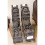 A pair of 17th Century wall brackets with grotesque faces,