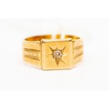 An 18 ct yellow gold gentleman's ring set with a small diamond in a star setting, size M,