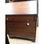 An Edwardian mahogany bureau, fitted with a fall front enclosing a fitted interior,