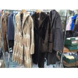 A moleskin full length coat, late 1940's early 50's; a sheepskin fur coat,