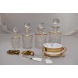 A set of four graduated French gold topped perfume bottles,
