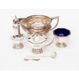 White metal sauce boat, pepperette, mustard pot silver spoon, and salt,