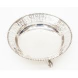 A George V silver dish, pierced gadrooned edge, raised on three scroll feet, Adie Brothers Ltd,