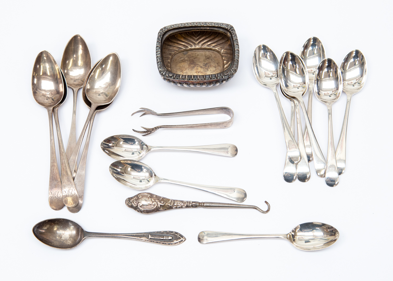 Group of silver teaspoons and tongs,