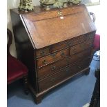 An early 18th century writing bureau, 12 internal drawers, a secret drawer and 6 external drawers..