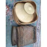 A square box containing a coolie hat (as worn in the paddy fields) Thailand,