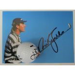 A signed photograph and ball by Sir Nick Faldo