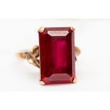 A 14 ct synthetic ruby emerald cut ladies dress ring, size L ½, 5.