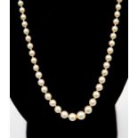 A string of pearls - graduated with a diamond and white metal clasp with safety catch