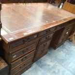 A reproduction pedestal writing desk.