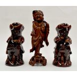 Wooden Japanese figure with two treacle glazed Toby jugs