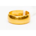 A 22 ct gold band, size M, weight 6.