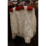 A cotton lawn white Edwardian blouse with lace insets and an embroidered leaf design with capped