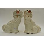A pair of Staffordshire white and gilt spaniels circa 1890 (crack to one dog)