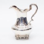 An early Victorian sterling silver helmet shaped milk jug, London 1850, Edward,
