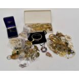 A collection of assorted costume jewellery comprising; necklaces, brooches, semi precious bracelets,