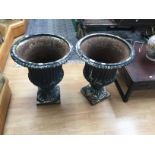 Two cast iron plater urns