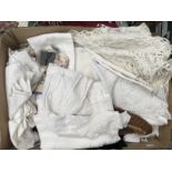 A collection of tablecloths to include damask tablecloths, napkins, tray cloths, lace tablecloths,
